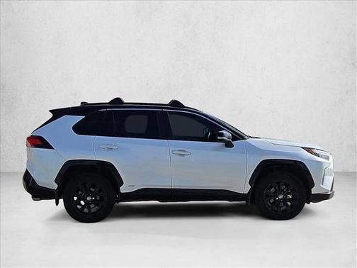 Wind Chill Pearl/Midnight Black Metallic 2023 Toyota RAV4 Hybrid SE