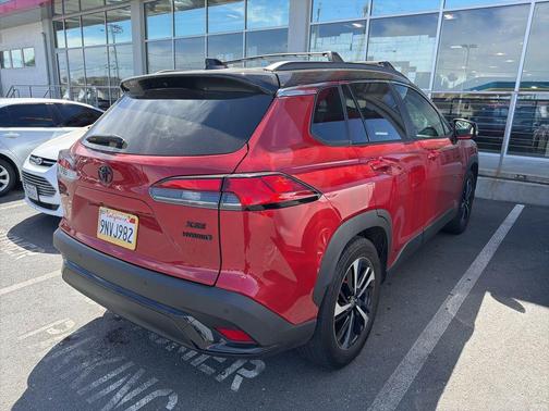 Barcelona Red Metallic/Jet Black 2024 Toyota Corolla Hybrid SE