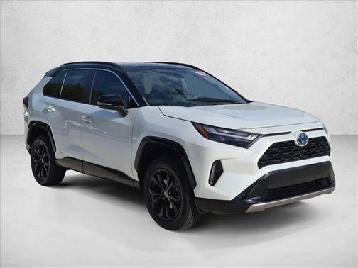 Wind Chill Pearl/Midnight Black Metallic 2023 Toyota RAV4 Hybrid SE