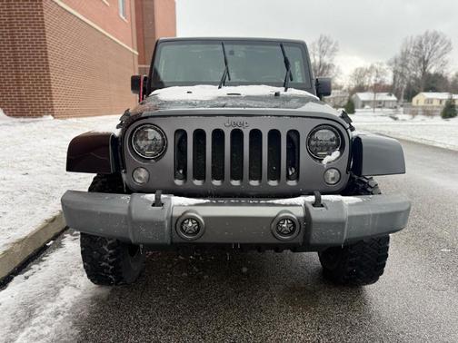 Black 2016 Jeep Wrangler Unlimited Sport