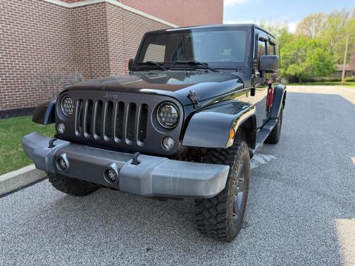 Black 2016 Jeep Wrangler Unlimited Sport