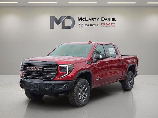 Volcanic Red Tintcoat 2026 GMC Sierra 1500 AT4X