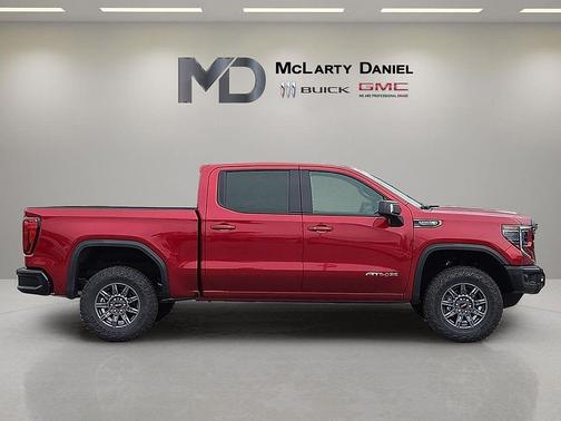 Volcanic Red Tintcoat 2026 GMC Sierra 1500 AT4X