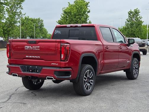 Volcanic Red Tintcoat 2026 GMC Sierra 1500 AT4