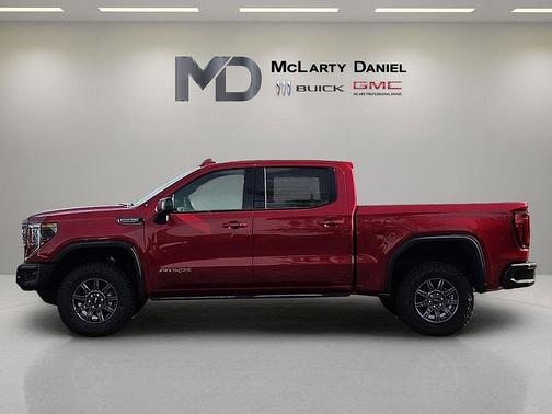 Volcanic Red Tintcoat 2026 GMC Sierra 1500 AT4X