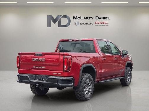 Volcanic Red Tintcoat 2026 GMC Sierra 1500 AT4X