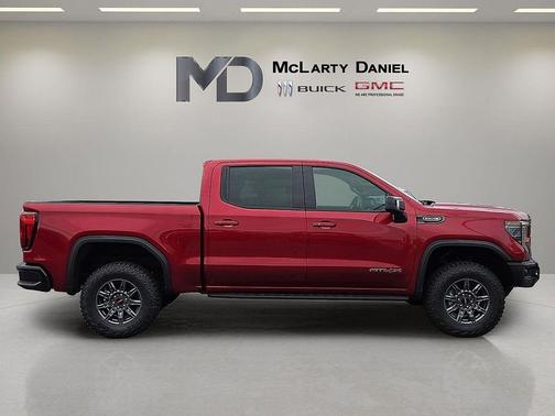 Volcanic Red Tintcoat 2026 GMC Sierra 1500 AT4X