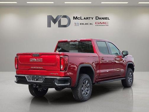 Volcanic Red Tintcoat 2026 GMC Sierra 1500 AT4X