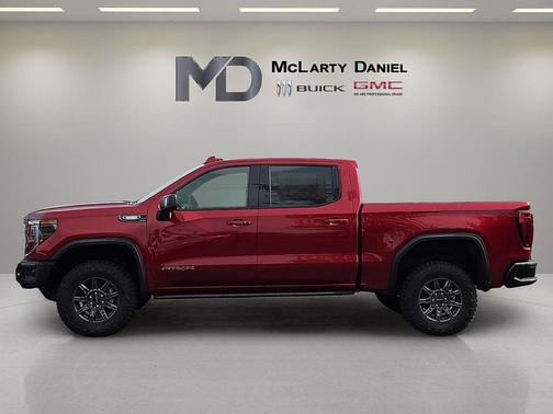 Volcanic Red Tintcoat 2026 GMC Sierra 1500 AT4X