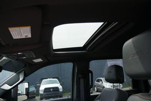 Volcanic Red Tintcoat 2025 GMC Sierra 2500 AT4