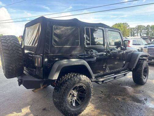 Black 2014 Jeep Wrangler Unlimited Sport