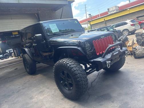 Black 2013 Jeep Wrangler Unlimited Sahara