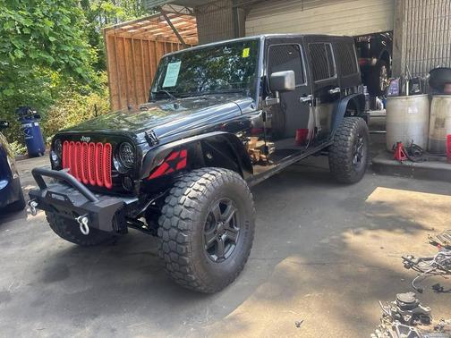 Black 2013 Jeep Wrangler Unlimited Sahara