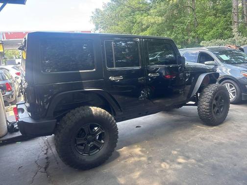 Black 2013 Jeep Wrangler Unlimited Sahara