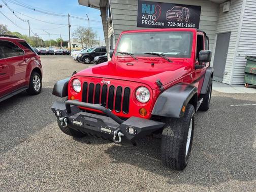 Red 2011 Jeep Wrangler Sport