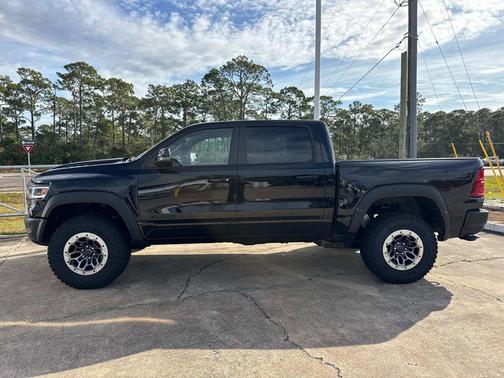 Diamond Black Crystal Pearlcoat 2026 RAM 1500 RHO Crew Cab 4x4 5'7' Box