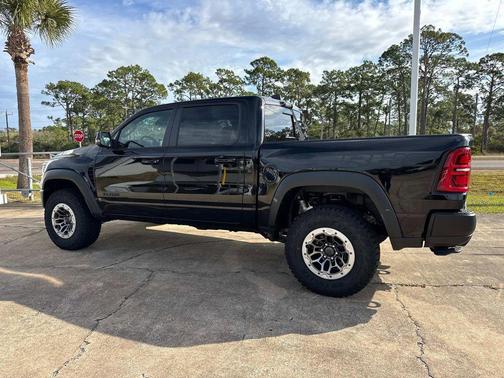 Diamond Black Crystal Pearlcoat 2026 RAM 1500 RHO Crew Cab 4x4 5'7' Box