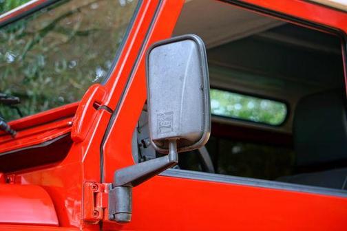 Red 1996 Land Rover Defender 90