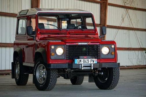 Red 1996 Land Rover Defender 90