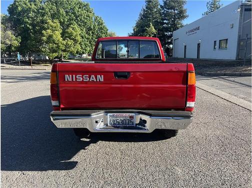 Red 1993 Nissan Pickup Truck Short Bed