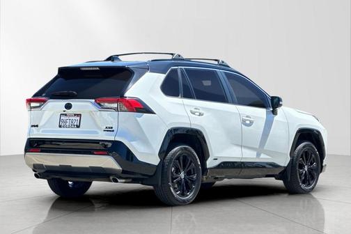 Wind Chill Pearl/Midnight Black Metallic 2023 Toyota RAV4 Hybrid SE