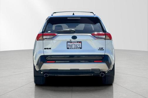 Wind Chill Pearl/Midnight Black Metallic 2023 Toyota RAV4 Hybrid SE