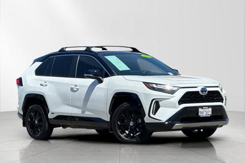 Wind Chill Pearl/Midnight Black Metallic 2023 Toyota RAV4 Hybrid SE