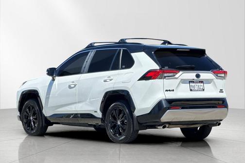 Wind Chill Pearl/Midnight Black Metallic 2023 Toyota RAV4 Hybrid SE