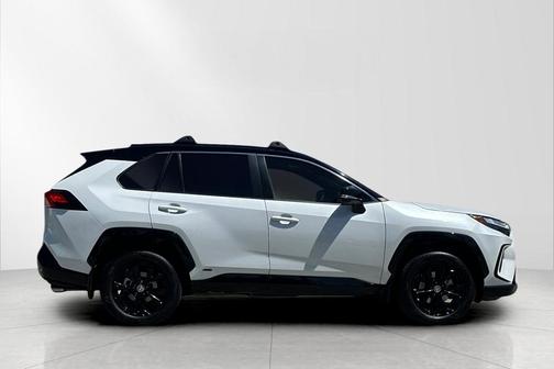 Wind Chill Pearl/Midnight Black Metallic 2023 Toyota RAV4 Hybrid SE