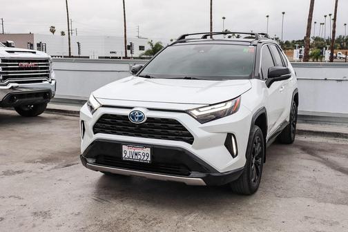 Wind Chill Pearl/Midnight Black Metallic 2024 Toyota RAV4 Hybrid SE