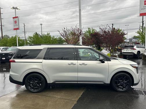 Ivory Silver 2025 Kia Carnival SX Prestige