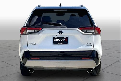 Wind Chill Pearl/Midnight Black Metallic 2024 Toyota RAV4 Hybrid SE