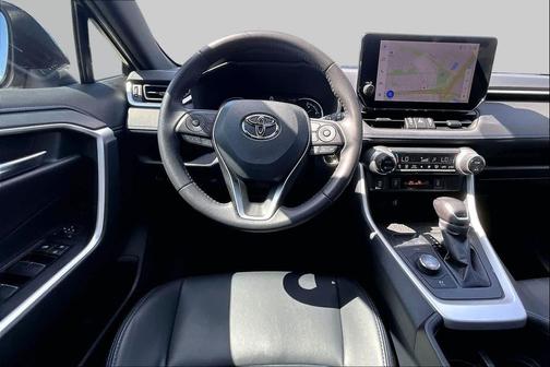 Wind Chill Pearl/Midnight Black Metallic 2024 Toyota RAV4 Hybrid SE