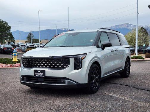 Ivory Silver 2025 Kia Carnival SX Prestige