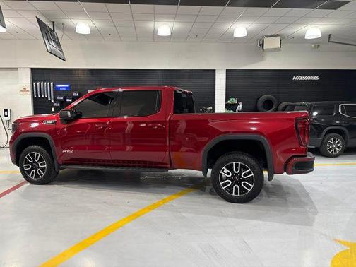 Volcanic Red Tintcoat 2025 GMC Sierra 1500 AT4
