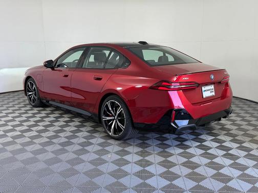 Red Metallic 2026 BMW 550e xDrive
