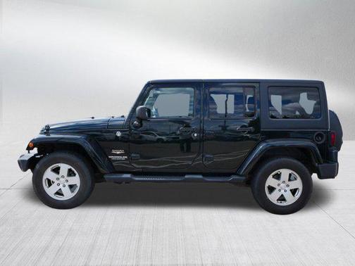 Black Forest Green Pearl 2012 Jeep Wrangler Unlimited Sahara