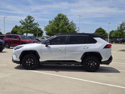 Wind Chill Pearl/Midnight Black Metallic 2023 Toyota RAV4 Hybrid SE