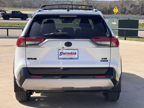 Wind Chill Pearl/Midnight Black Metallic 2023 Toyota RAV4 Hybrid SE