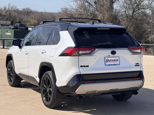 Wind Chill Pearl/Midnight Black Metallic 2023 Toyota RAV4 Hybrid SE