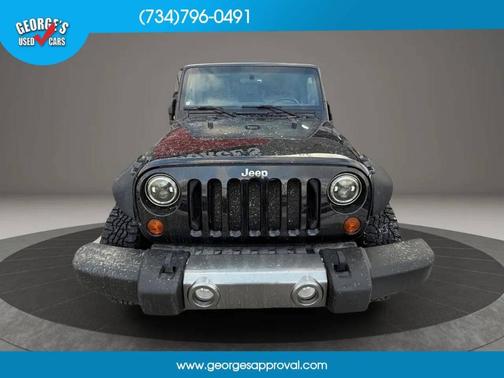 Black 2011 Jeep Wrangler Unlimited Sport