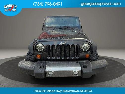 Black 2011 Jeep Wrangler Unlimited Sport