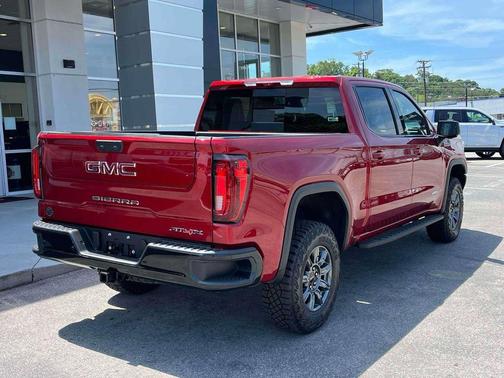 Volcanic Red Tintcoat 2026 GMC Sierra 1500 AT4X