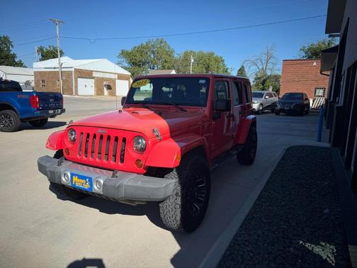 Orange 2013 Jeep Wrangler Unlimited Sahara