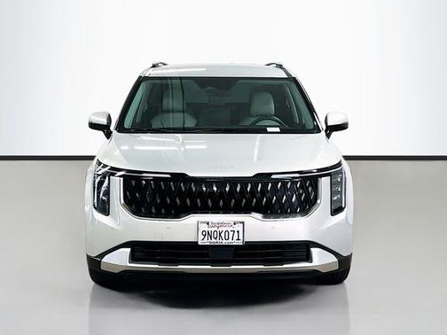 Ivory Silver 2025 Kia Carnival EX