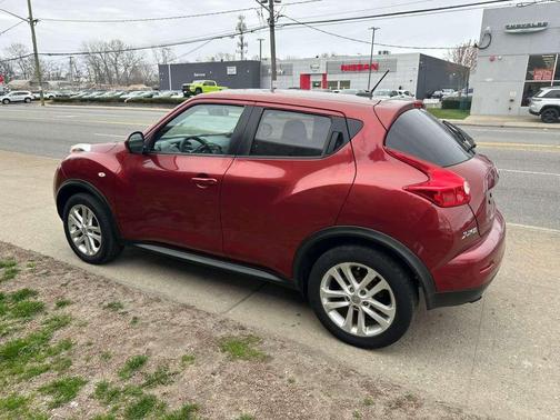 Red 2013 Nissan Juke SV AWD 4dr Crossover