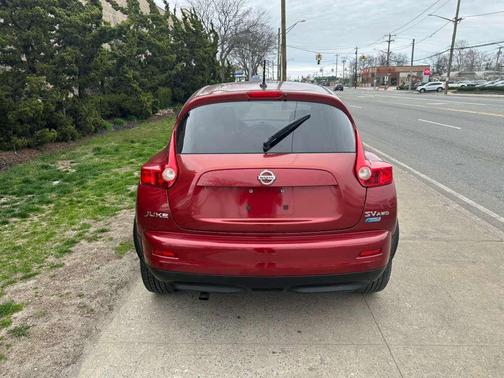 Red 2013 Nissan Juke SV AWD 4dr Crossover