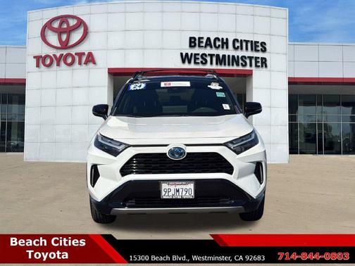 Wind Chill Pearl/Midnight Black Metallic 2024 Toyota RAV4 Hybrid SE
