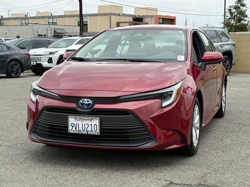 Ruby Flare Pearl 2025 Toyota Corolla Hybrid LE