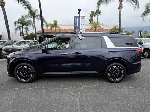 Blue 2025 Kia Carnival EX